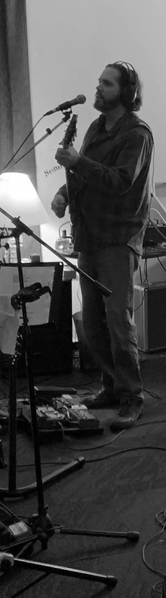 Brian Farr, singing into a mic